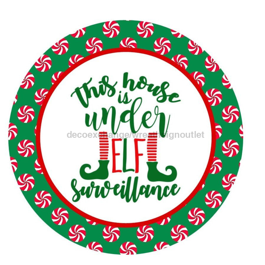 THIS HOUSE IS UNDER ELF SURVEILLANCE ELF WINTER CHRISTMAS 10.5" Vinyl Wreath Sign - UTIC-VINYL-V989